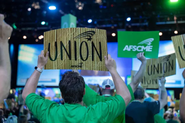 Oregon AFSCME member holding up Union Sign